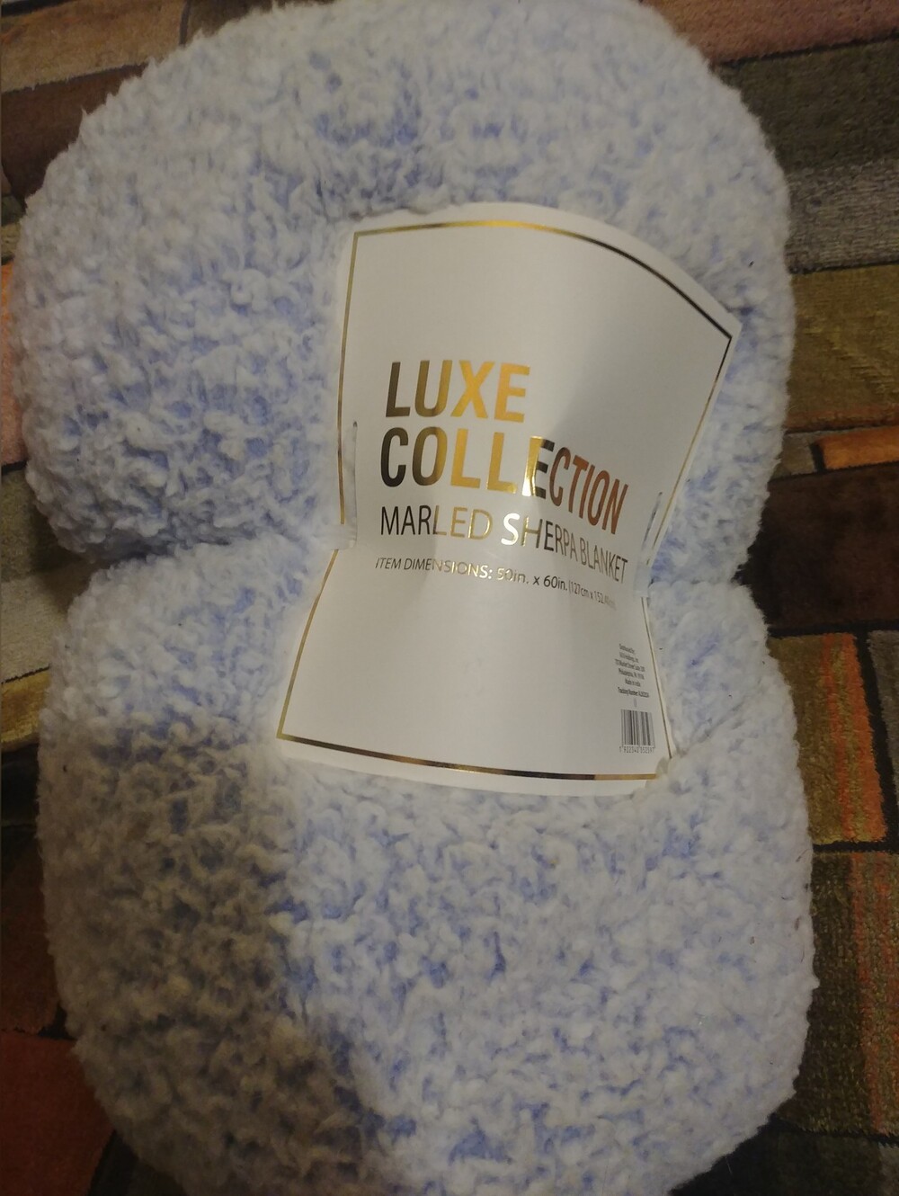 Luxe Collection Marled Sherpa Throw Blanket measuring 50 inches by 60 inches